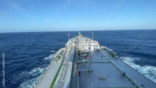 gas tanker. Bow, upper deck, pipe lines, cranes, wheelhouse and radar mast of a tanker ship on ride. photo