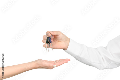 A man gives the keys to a girl isolated on white studio background, the real estate mockup concept. photo