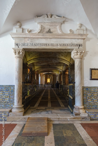 Entrance of Capela dos Ossos with human bones at the St Francis Church or igreja de Sao Francisco in the old Town of Evora, Alentejo, Portugal
