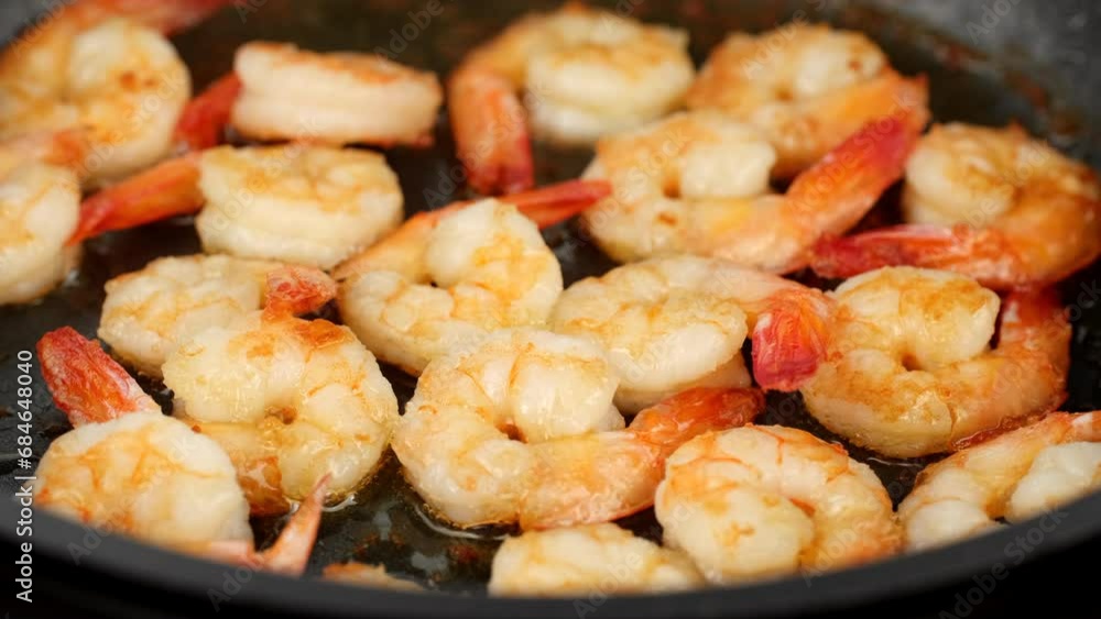 Fresh shrimps fried in oil pan, close up Fresh shrimps fried in oil pan, close up