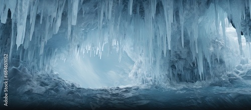 An icy frame on Olkhon Island made of stalactites in a Baikal ice cave copy space image © vxnaghiyev