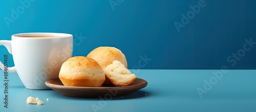 Coffee and cheese bread Pão de queijo served in a blue bowl copy space image photo