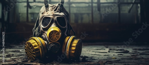 Contaminated gas mask in deserted Chernobyl school within exclusion zone copy space image photo