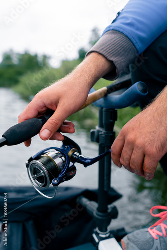 close-up Fly fisherman male hands with fishing rod or spinning in hands feeder free style method