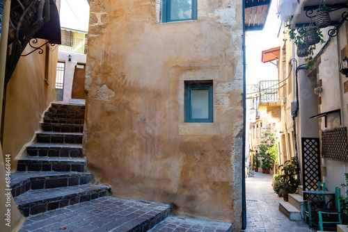 Crete island, Chania Old Town Greece. Traditional peeled building, stair drives home, paved alley. © Rawf8