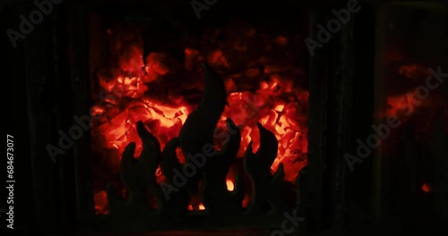 Flame of the charcoal grill. Coal lit in the stove. Hot ember, hot coal inside a stove photo