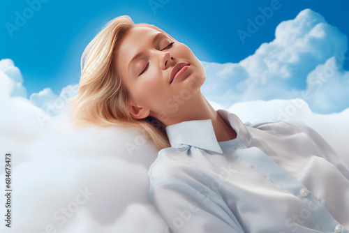Beautiful young woman blonde is sleeping in the sky on fluffy clouds. Lush hair accentuates her beauty. Her face is calm and peaceful. She has beautiful dreams. Blue sky. Close-up. Copy space.