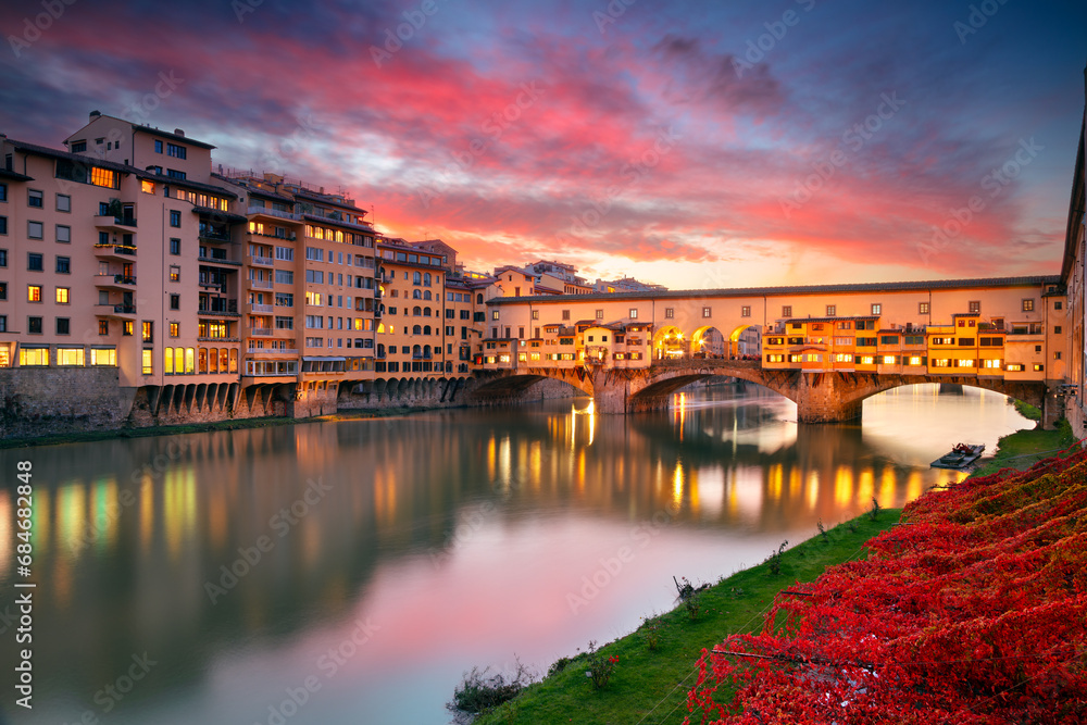 Florence, Italy. Cityscape image of iconic Florence, Italy with famous Ponte Vecchio (Old Bridge) at beautiful autumn sunset.