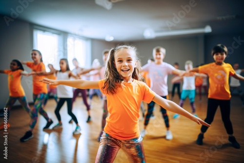 Portrait of smiling children of 7-13 years old enjoying modern dancing in a dance studio