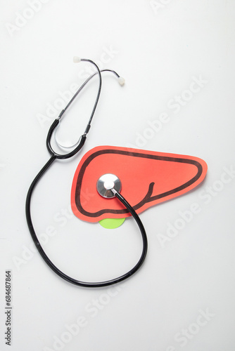 Healthy liver shape made from paper on white background.