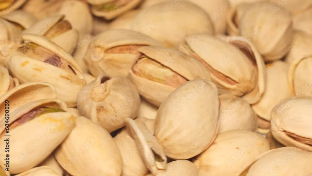 Macro video of pistachio nuts rotating in a circle. Healthy food. Vegetarianism Macro video of pistachio nuts rotating in a circle. Healthy food. Vegetarianism