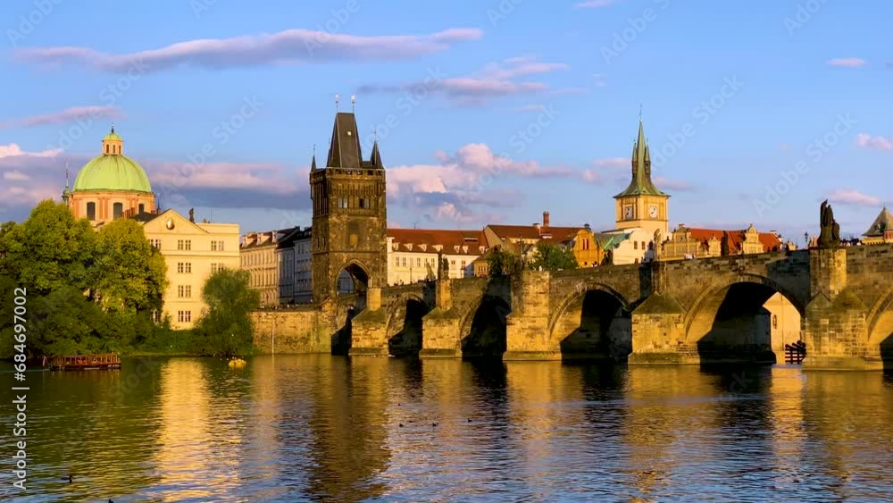 Scenic view of the Old Town pier architecture and Charles Bridge over Vltava river in Prague, Czech Republic. Prague iconic Charles Bridge (Karluv Most) and Old Town Bridge Tower at sunset, Czechia. Scenic view of the Old Town pier architecture and Charles Bridge over Vltava river in Prague, Czech Republic. Prague iconic Charles Bridge (Karluv Most) and Old Town Bridge Tower at sunset, Czechia.