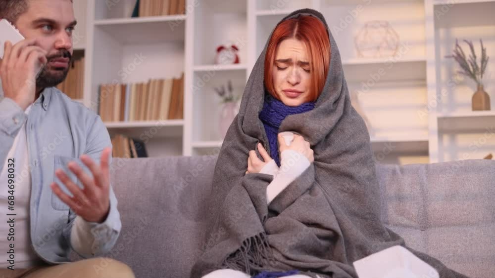 Worried husband calling to doctor because wife coughing sneezing and having severe headache temperature at home Unhealthy woman with man who distance remote talking with therapist indoors Worried husband calling to doctor because wife coughing sneezing and having severe headache temperature at home Unhealthy woman with man who distance remote talking with therapist indoors