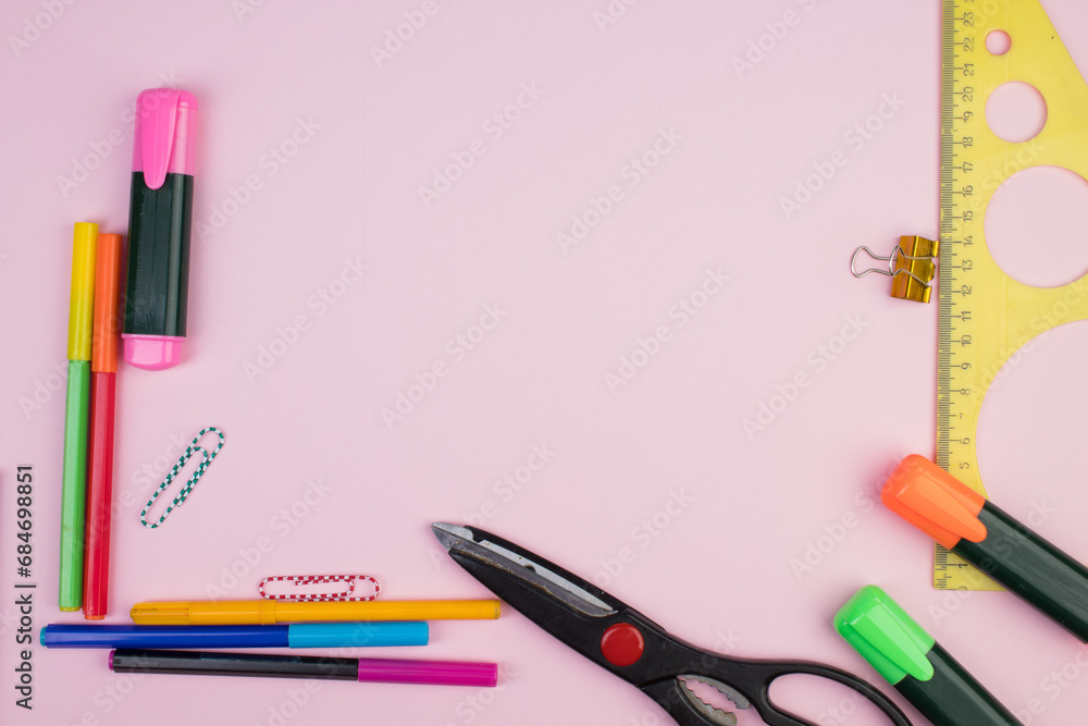 Back to school. Stationery on a pink table. Office desk with copy space. Flat lay. Back to school. Stationery on a pink table. Office desk with copy space. Flat lay.