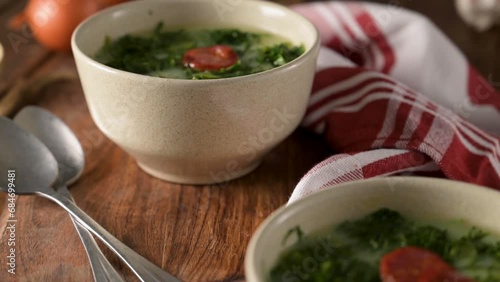 Caldo verde popular soup in Portuguese cuisine. traditional ingredients for caldo verde are potatoes, collard greens , olive oil and salt. Additionally garlic or onion may be added.