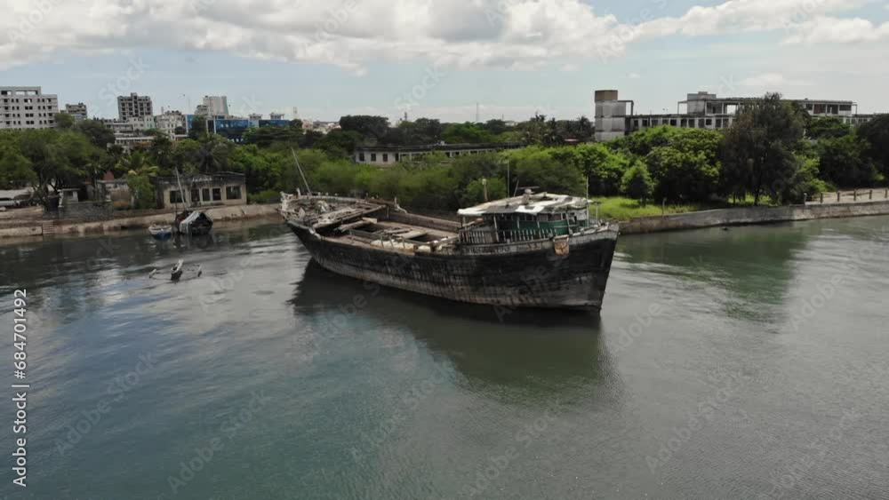 aerial views Old wooden Dhow vessel under repair moored in shallow water aerial views Old wooden Dhow vessel under repair moored in shallow water