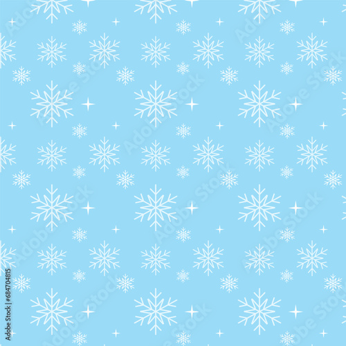 Seamless pattern with snowflakes on blue background.