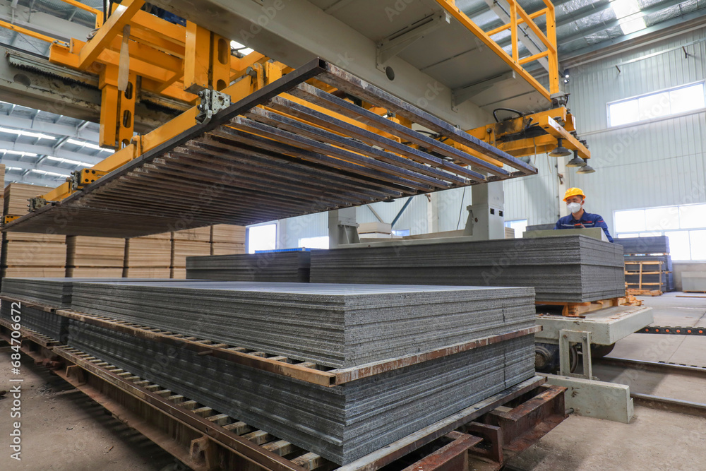 Workers work nervously on the production line of new building materials calcium silicate board, North China