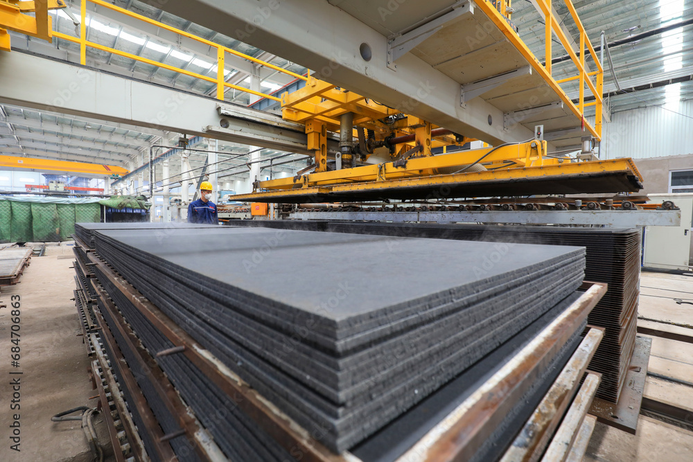 Workers work nervously on the production line of new building materials calcium silicate board, North China