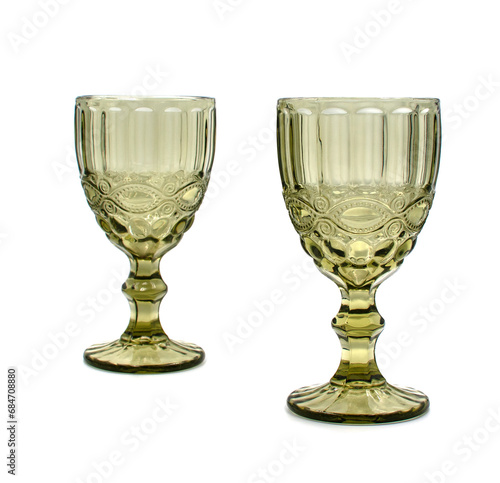Two empty vintage glasses for wine and champagne on a white background. 