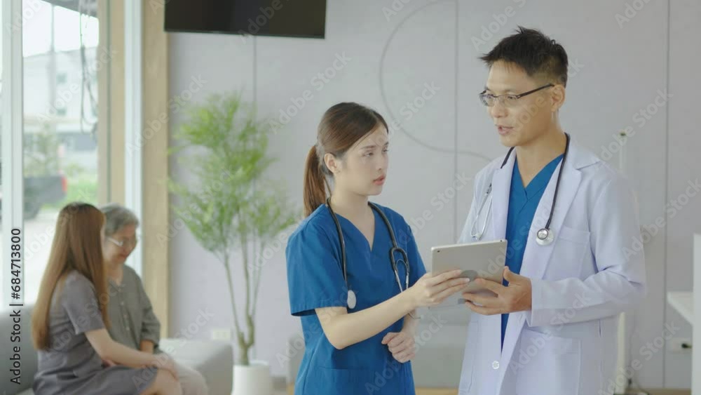 Doctor, nurse and tablet for talking in hospital of strategy for patient diagnosis. Medical professional, collaboration and chart on clipboard, There was a patients looking for a doctor behind him Doctor, nurse and tablet for talking in hospital of strategy for patient diagnosis. Medical professional, collaboration and chart on clipboard, There was a patients looking for a doctor behind him