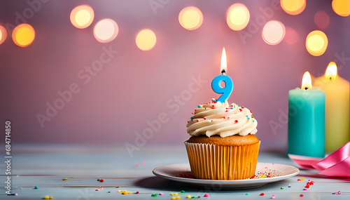 Birthday cupcake with lit birthday candle Number nine for nine years or ninth anniversary