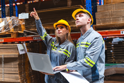 Female engineer using laptop computer for safety control checks or manufacturing maintenance work in factory building or construction site. woman engineer inspector working in industry product line
