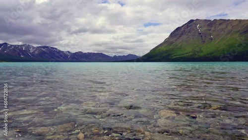 Upper Twin Lake at Twin Lakes near Dick Proenneke's Cabin in Lake Clark National Park and preserve. Rocks in clear, turquoise, glacial water. 