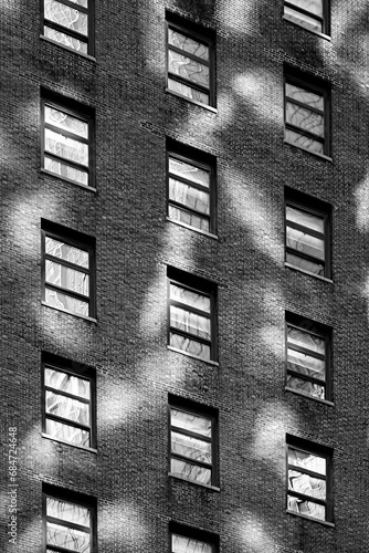 Photography Monochrome black and white brick city apartment building with windows and reflec