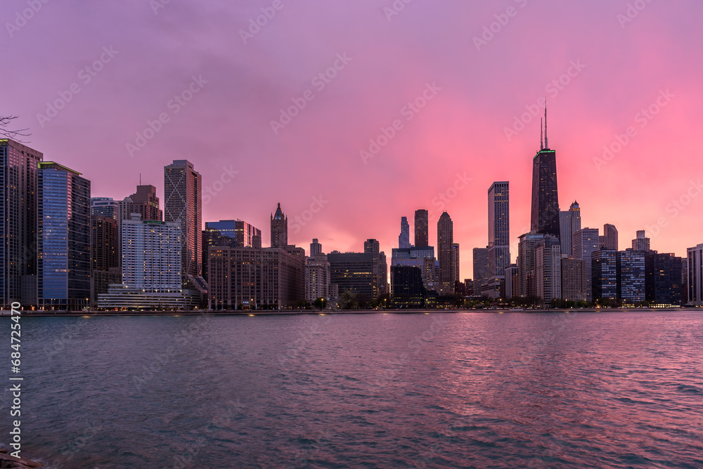 Chicago skyline under colourful cloudy sky at sunset in spring