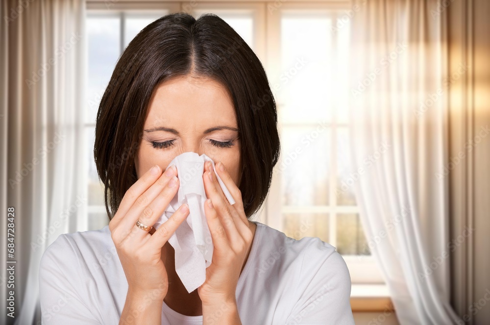 sick young woman sneezing with allergy or flu sick young woman sneezing with allergy or flu