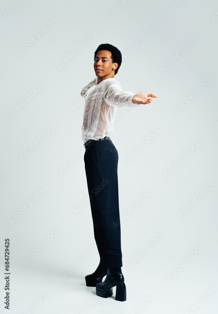 Fashionable homosexual man posing in studio - Fluid gender non binary hispanic  man posing in studio with fashionable clothing - concepts about LGBTQ, genderless and diversity