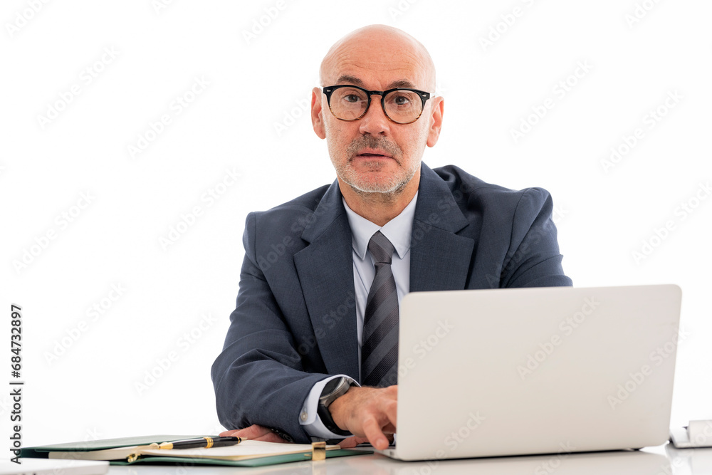 Executive businessman using laptop against isolatd white background Executive businessman using laptop against isolatd white background