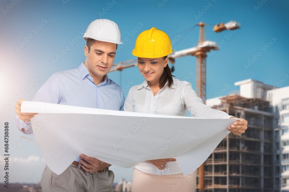 A team of engineers and architects inspect construction site A team of engineers and architects inspect construction site