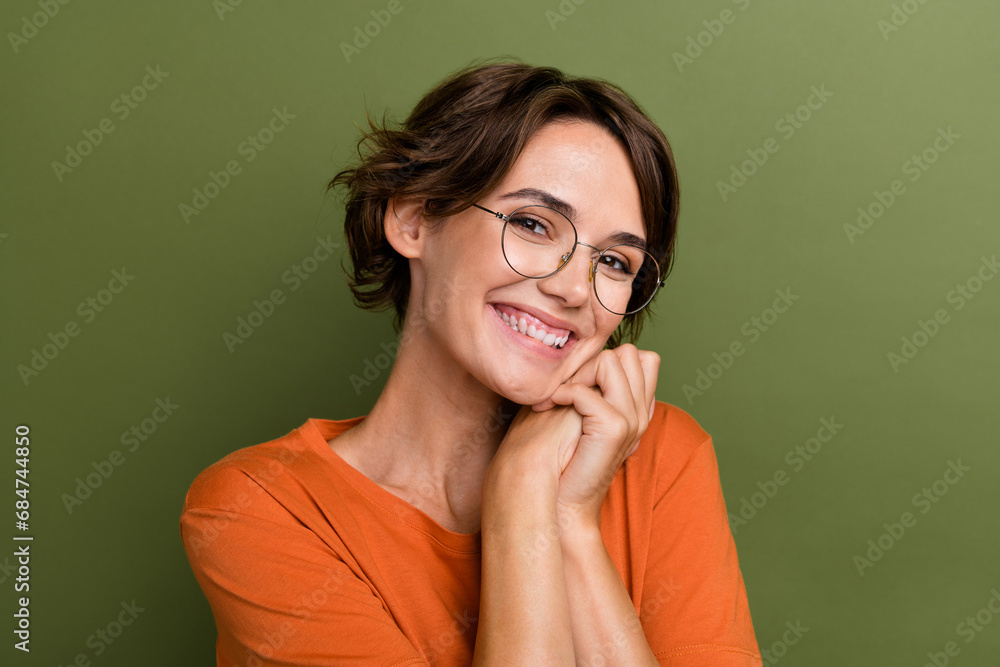 Portrait of cute young satisfied lady hands together toothy smiling pretty person dreaming looking you isolated on khaki color background Portrait of cute young satisfied lady hands together toothy smiling pretty person dreaming looking you isolated on khaki color background