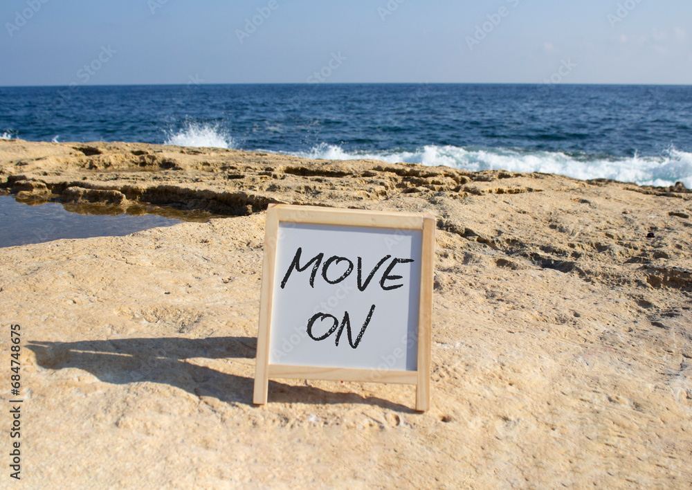 Move on symbol. White chalk background with words Move on on. Beautiful sea background. Business and Move on concept. Copy space.