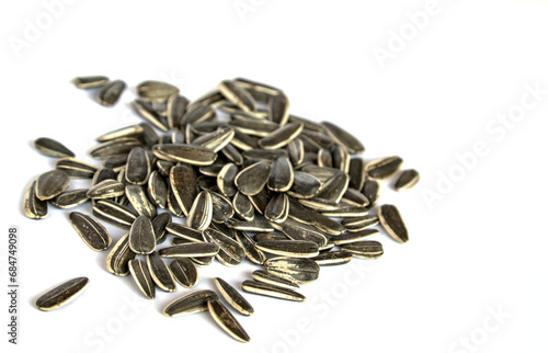 sunflower seeds in a pile isolated on white background (cut out roasted, raw seed) grain, turkish snack food