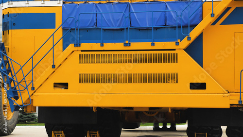 A new quarry dump truck on the territory of the plant. The largest dump truck in the world. Front view. Close-up. Specialized equipment. photo