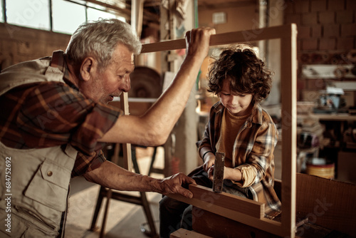 Multi generational family in the woodworking workshop