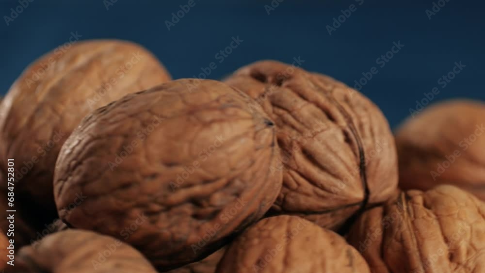 Walnuts in a shell rotating top view. Healthy snacks. Product rich in minerals and vitamins. Walnuts in a shell rotating top view. Healthy snacks. Product rich in minerals and vitamins.