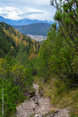 View from the mountains down on the viallge of Seefeld and the opposite summits