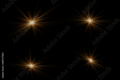 Set of highlights. Flashes of rays of light. The effect of glow, radiance, shine. Collection of various glowing sparks, stars. On a black background.