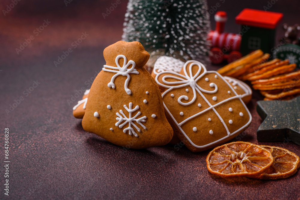 Beautiful delicious sweet winter Christmas gingerbread cookies on a bronze textured background