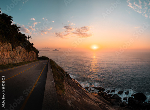Estrada cênica a beira mar com nascer do sol, Rio de Janeiro photo