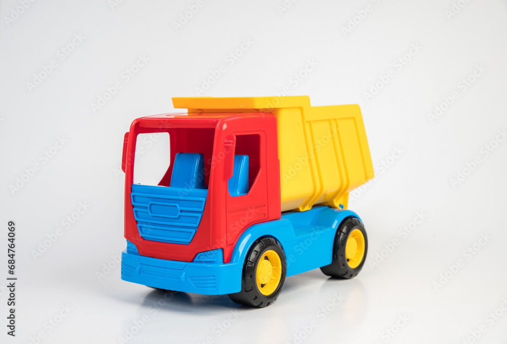 Naklejka premium Plastic toy models of construction vehicles. Truck.
