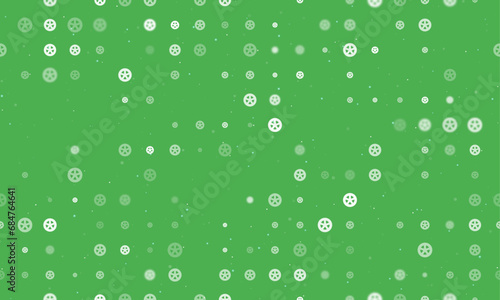 Seamless background pattern of evenly spaced white car wheel symbols of different sizes and opacity. Vector illustration on green background with stars