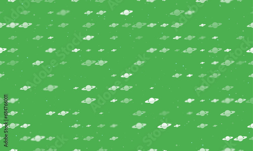 Seamless background pattern of evenly spaced white saturn symbols of different sizes and opacity. Vector illustration on green background with stars