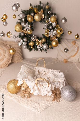 New Year's decor. Decor for the New Year. New Year's photo shoot for a newborn. Photo zone for a newborn with New Year's decor. Christmas wreath on the wall.