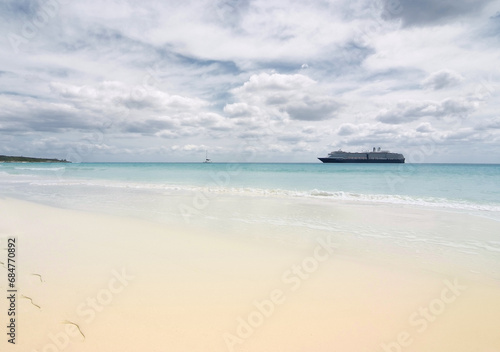 Anchored Vessel on Idyllic Beach © Visual Voyager