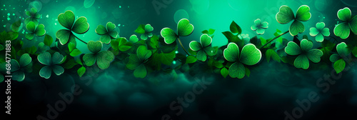 green st patrick's day background with clovers. Copy space. Panorama view